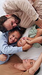 Playful, parents or children on bed with tickle, bonding together or fun time with childcare. Happy, laugh or family in home with love, healthy relationship or connection for childhood development.