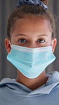 Face, child and girl with mask at house for safety, health protocol and infection prevention. Portrait, kid and hantavirus ppe with healthcare compliance, medical precaution and pandemic quarantine