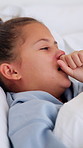 Bed, cough and tissue with sick girl in home for symptoms of disease, illness or infection. Allergies, blowing nose and hayfever with child in apartment bedroom for healthcare, sinusitis or virus