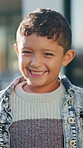 Boy, child and face in backyard with smile, outdoor or sunshine for wellness or holiday. Kid, portrait and excited to play in garden for weekend, childhood or summer break at home with happiness