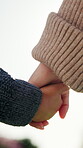 Holding hands, love and safety of child with parent outdoor together for bonding or support. Family, relationship and security of son with mother in neighborhood for development, future or growth