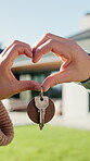 Heart, hands and couple with keys for new house, moving and real estate with outdoor backyard. Property, investment or mortgage with love sign, support and together with people for security for home