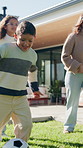 Kids, running and family in backyard with soccer ball for playing outdoor with new home. Excited, fun and happy children with parents for bonding, football game and wellness on lawn in garden