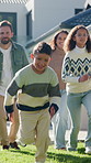 Family, running and children outdoor in backyard for playing, happiness and bonding at home. Excited, wellness and mother and father smile with kids for fun games, weekend or holiday on property