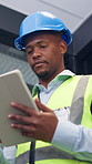 Black man, tablet and engineer in building for construction development, schedule and planning. Tech, architecture or person with review for inspection, maintenance or think of project with low angle