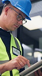 Tablet, man and contractor on site for planning, research or inspection on building maintenance. Digital technology, professional and male civil engineer with online report for construction repairs.