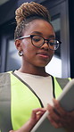 Tablet, black woman and contractor on site for inspection, research or planning building maintenance. Technology, checklist and female civil engineer with online report for construction repairs.