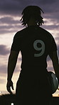 Night, rugby and back of man with ball field for training, practice and ready for tournament. Sports, outdoor and person with determination, thinking and reflection for competition, game and match