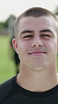 Face, athlete and man on field for fitness, training and match practice for rugby tournament. Portrait, smile and male person outdoor with positive attitude, sports game and confident for competition