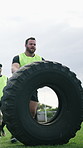 Sports, practice and people with tire on field for match, competition and stamina for tournament. Rugby, team and men with equipment for exercise, workout and warm up for game, training and strength
