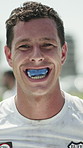 Face, rugby and man with mouthguard for protection, safety and smile at game training for wellness. Portrait, sports player and person with teeth shield, athlete and exercise with fitness outdoor
