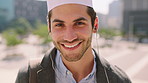 Face, commute and Muslim man in city with earphones, streaming music and smile for finance career. Happy, Islamic person and accountant in urban town with audio tech, online radio and travel to work.
