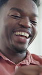 Scroll, phone and man in house, laughing and streaming movies with app subscription on social media. Happy, black person and watching funny video on website, online and relax with internet connection