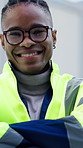 Face, construction site and happy black man with confidence, building engineer and laugh. Portrait, funny architect and person with glasses in city, arms crossed and development for maintenance