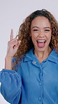 Woman, face and pointing up for advertising in studio, information or announcement on white background. Communication, hand gesture and excited person with news, notification or alert for mockup