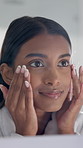 Cosmetics, woman and check skin in mirror for foundation coverage, natural glow and hydration. Reflection, person and happy with beauty inspection in home for makeup results, self care and skincare