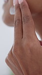 Woman, hands and skincare with lotion in bathroom for moisturizer, grooming or smooth skin in home. Female person, face cream and applying with cosmetics for facial treatment or beauty in house