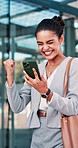 Fist pump, phone and businesswoman in glass office with winning, capital gain or approval on investment. Excited, cellphone and financial manager with celebration for finance achievement in workplace