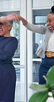 Teamwork, happy and business people dancing in office for good news on finance deal approval. Excited, documents and group of financial advisors with groove for positive feedback on investment.