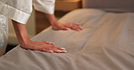 Hands, morning and woman making bed in home for daily routine, fresh fabric or maintenance. Change, cleaning and tidy with person in bedroom of apartment for chores, housework or responsibility