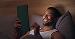 Night, relax or happy man with tablet in bedroom for online browsing, network or social media. Male person, smile and scrolling with technology in bed for late entertainment, internet or connection