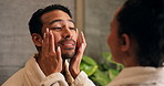Skincare, couple and cream in bathroom, help and talk with facial cosmetics for hydration. Man, woman and apply moisturizer for dermatology with beauty care, wellness or collagen with love at home