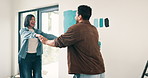 Real estate, fun or Asian couple in house with dance, fresh start or happy moment in dream home. Property, bonding or people with playful groove, housing success or moving celebration for homeowners.