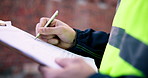 Clipboard, hands and man on construction site for task brief, inspection or safety update. Writing, management and engineer with paperwork, progress report or project coordination for renovation