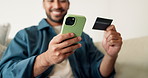 Phone, credit card and hands of man on sofa in home with online shopping, ecommerce or purchase on app. Relax, debit and male person with cellphone for order on website in living room at apartment.