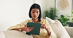 Woman, student and reading in home with tablet, research and application for college education. Person, relax or tech at house for elearning, scholarship update and university enrollment for learning
