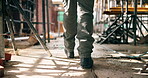 Construction, walking or legs on site with inspection, safety check or quality control in building project. Back, man or engineer with boots, progress track or evaluation in industrial compliance.