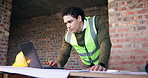 Man, laptop and blueprint on construction site for infrastructure, inspection or update planning. Architecture, paperwork and engineer with tech for report, project management for renovation design