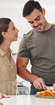 Vegetables, happy and couple in kitchen with cooking for dinner, meal or healthy diet together. Smile, bonding and man with woman for cutting ingredients for preparing supper with nutrition in house.