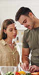 Vegetables, learning and couple in kitchen with cooking for dinner, meal or healthy diet together. Tutorial, bonding and people for cutting ingredients for preparing supper with nutrition in house.