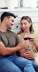 Laugh, couple or cheers with red wine on kitchen floor for marriage growth, love and conversation. Support, happy people or drinks toast in home for relationship celebration, bonding or weekend break