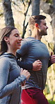 Happy, couple and running in woods with fitness, healthy relationship or cardio workout for wellness. Married people, smile and runner in nature with outdoor exercise, endurance training or movement.