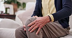 Hurt, hands and old woman in house with knee pain, medical problem and massage for arthritis symptoms. Senior person, legs and injury in retirement with osteoporosis, joint inflammation and tension.