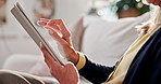 Hands, woman and relax in home with tablet, social media and browsing website for streaming. Scroll, rest and senior person with digital, download ebook and multimedia for movies subscription on sofa