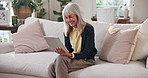 Smile, old woman and relax in home with tablet, streaming and browsing website for film. Happy, rest and senior person with digital app, download ebook and multimedia for movies subscription on couch