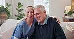 Face, caregiver and old man at house with smile, assistance and support for medical advice. Portrait, nurse and senior person in lounge with embrace, assisted living and elderly care for healthcare