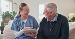 Senior man, smile and caregiver with tablet in nursing home, discussion and explaining test results. Elderly person, relieved and nurse with tech for treatment plan, healthcare and good news in house