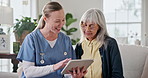 Nurse, conversation and old woman in retirement home with tablet, support and feedback for wellness. Happy, caregiver and senior person on sofa with tech, healthcare assistance or advice for checkup.