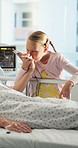 Hospital, visit and child with parent for kiss, holding hands and support for medical surgery. Healthcare, family and girl with person for comforting, compassion and bonding with love for healing