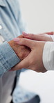 Holding hands, hospital and doctor with patient for comfort, empathy and support for medical results. Healthcare, closeup and people for compassion, care or console for wellness, diagnosis or healing
