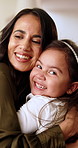 Face, mother and child at house with hug, love and parental affection for bonding together. Portrait, woman and embrace in lounge with daughter, family connection and relationship for weekend break