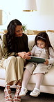 Mother, child and conversation in home with tablet, bonding together and learning to play online game. Woman, daughter and relax in living room with tech, discussion and knowledge for gaming website.