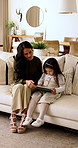 Mother, child and conversation in home with tablet, education or learning to play online game together. Woman, daughter and relax in living room with tech, discussion or knowledge for gaming website.