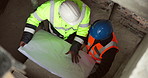 Above, blueprint and civil engineers on site for discussion on building, renovation or repairs. Conversation, men and construction workers with floor plan for maintenance on industrial project.