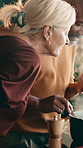 Cooking, interracial couple or smell food in home for dish flavor, fresh ingredients or high five. Meal prep, mature people or supper aroma with celebration for recipe scent, homemade diet or support