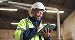 Research, black man and carpenter with tablet in workshop for research on furniture manufacturing. Digital technology, ideas and mature woodworker with planning for timber project from below.